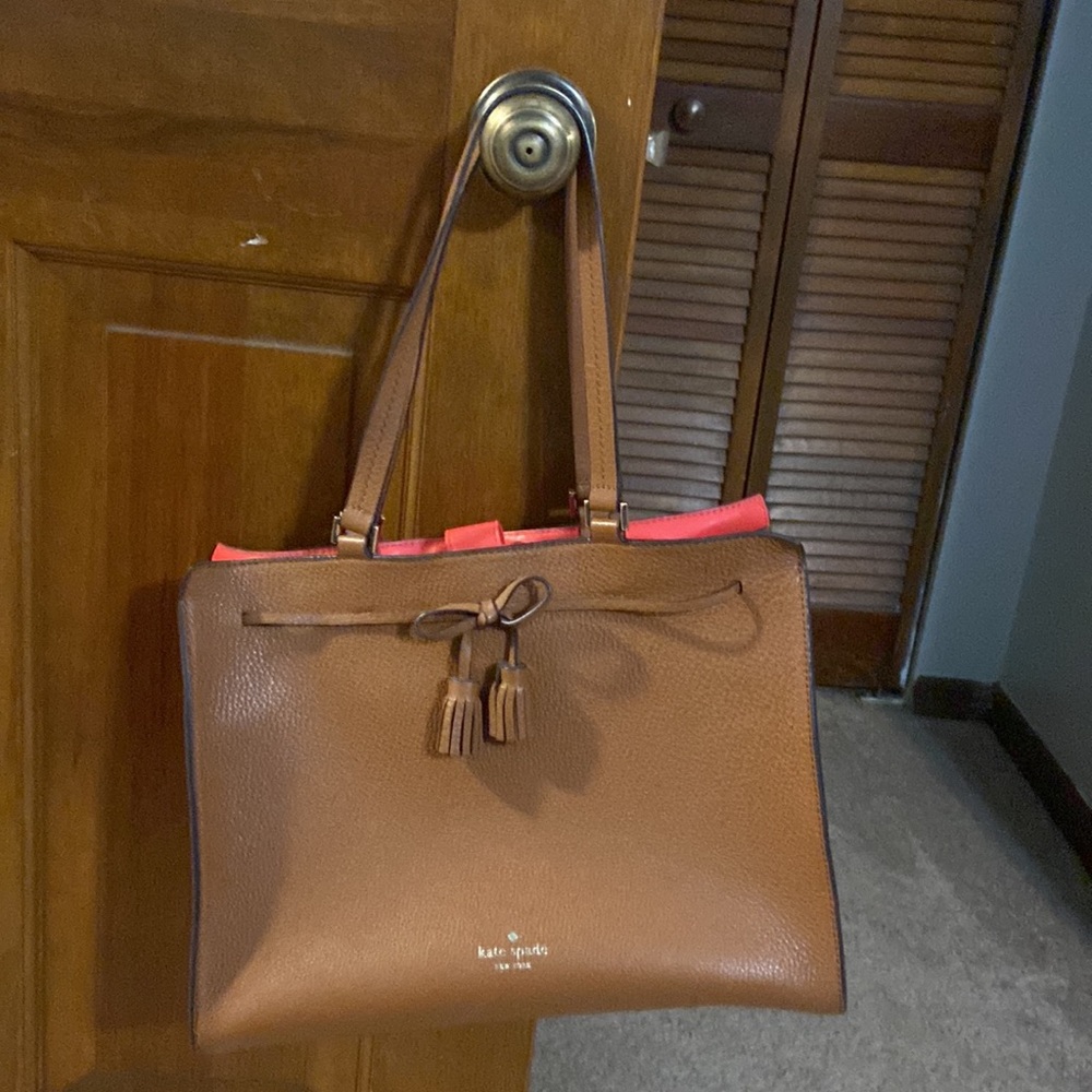 Brown leather Kate Spade handbag with beautiful red interior lining
